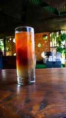a glass of cold mocktail served on the table