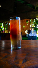 a glass of cold mocktail served on the table