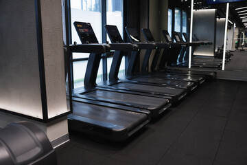 Many modern professional treadmills in gym. Healthy lifestyle