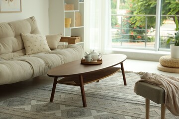 Coffee table, sofa and decor in dining room. Interior design