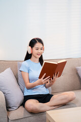 attractive asian young woman relax resting using smart phone for play music streaming application...