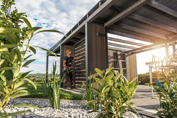 Construction of a Modern Outdoor Structure With a Worker Engaged in Carpentry
