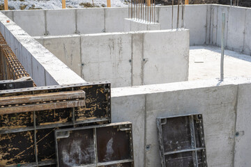 Construction Site With New Concrete Foundation Being Prepared in Residential Area