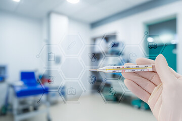 Checking temperature in a medical setting.
