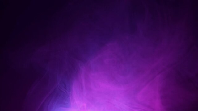 Slow Motion Shot of Modern Neon Smoke Abstract Background on Black