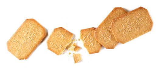 Broken sugar coated cinnamon biscuits with crumbs isolated on white	