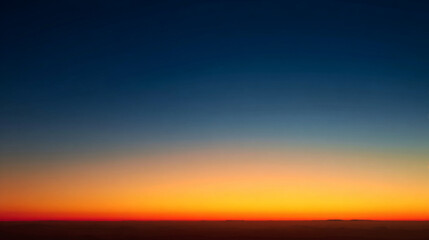 Colorful sunrise gradient from dark to golden sky