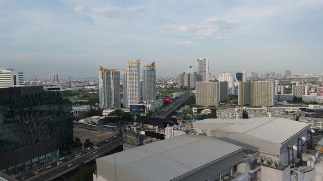 Traffic At Sirat Expressway With TC-Green Condominium In Huai Khwang, Bangkok, Thailand. - aerial shot