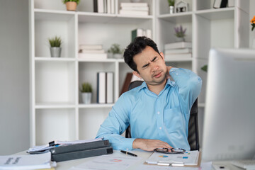 Overcoming shoulder pain from hard work a businessman's struggle office environment stress relief...