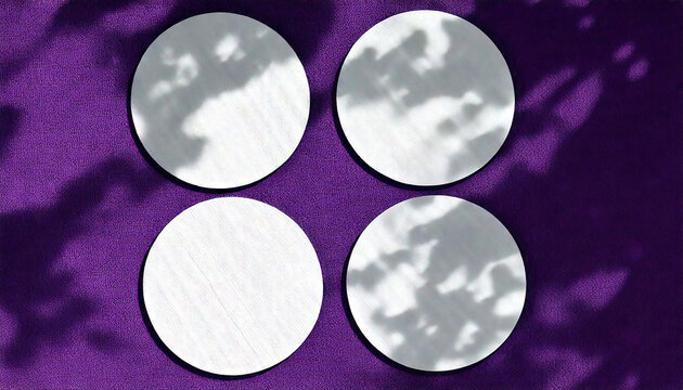 Natural light casts shadows from an exotic planton 6 round sheets of white textured paper
