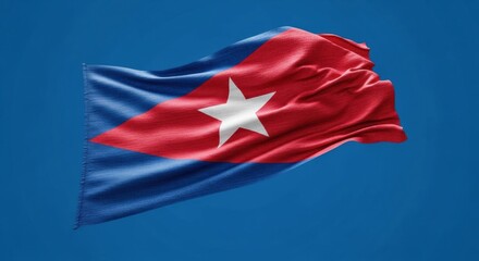 The national flag of Cuba, known as the Lone Star or Estrella Solitaria, waving with a textured fabric feel against a deep blue sky.