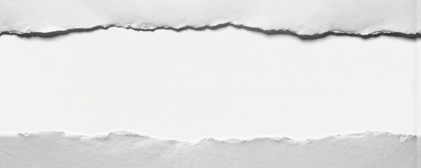 Close-up white paper edges with ragged torn texture and shadow detail. Artistic layout showcases blank textured surface, perfect for creative design, vintage themes or background elements.