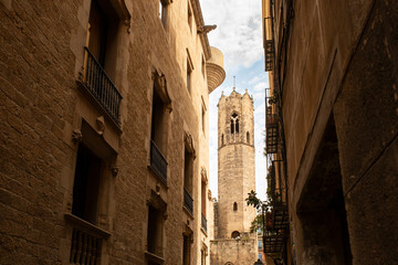 Cathedral Tower Framed Between Buildings in Gothic Barcelona