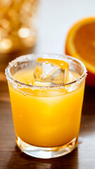 Macro product photography of a glass of juice with a salt rim