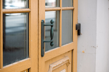 old door with iron handle and brown glass partition, copy space