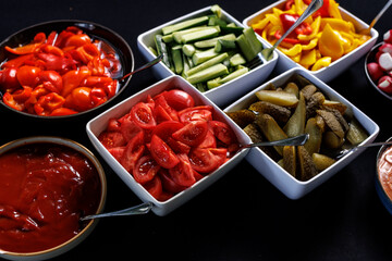 Colorful assortment of cut vegetables in bowls
