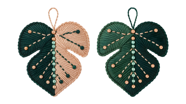 Two green and beige leaf ornaments with beads and stitching brown png image download 