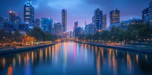 Naklejka premium Melbourne skyline at night reflecting in Yarra River