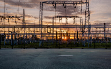 Transformer station and power transmission lines in the setting sun
