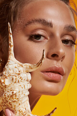 Sunkissed elegance shines through summer styles in a vibrant studio setting