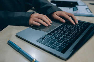 Entrepreneur Asian businessman and businesswoman discussing new business project in tablet in...