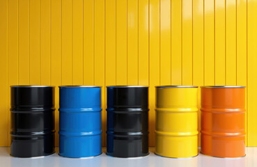 Colorful metal barrels arranged in a row against a vibrant yellow background