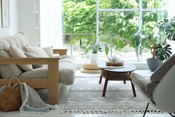 Coffee table, sofa and decor in dining room. Interior design