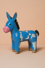 A charming, antique, blue painted donkey statue. The paint is worn, with a pink nose, and a black tail and mane. Quirky folk art.
