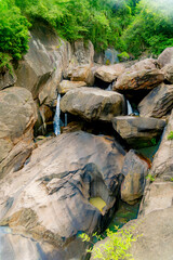 A small waterfall.

Mountain lakes and rivers of the Baho Falls near Nha Trang in Vietnam. During the rainy season, this place turns into a deep river with large waterfalls. 