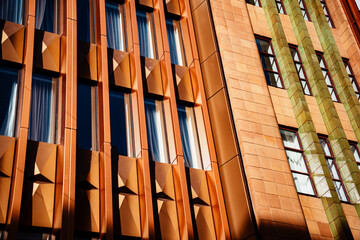 Close-up of contrasting architectural facades on Bourke Street with geometric and tiled patterns.