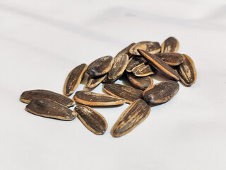 Roasted sunflower seeds in black and white striped shells, ready to be enjoyed as a healthy snack.