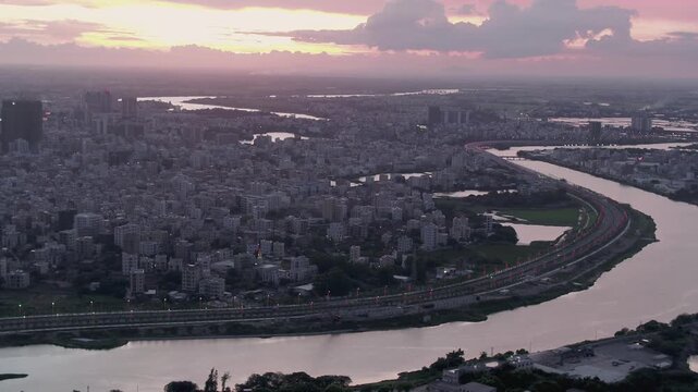 Stunning sunset over Zhanjiang Wuchuan highlighting urban landscape and river