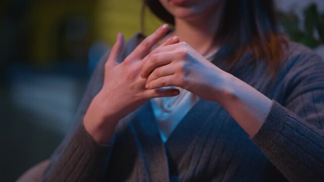 Caucasian woman sad at home night evening upset take off wedding ring frustrated girl female wife regret thinking marriage problem breakup divorce betrayal engagement heartbreak difficult decision