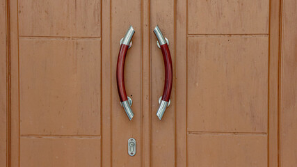 Wooden Panel Door with Modern Red and Silver Handles, Rustic Style