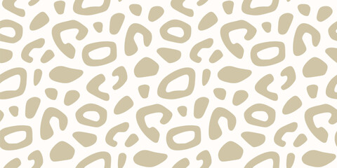 Golden leopard print. Vector seamless pattern with spots, organic shapes. Cut-out style illustration. Animal skin texture, jaguar, cheetah, leo fur. Abstract gold and white background. Repeated design