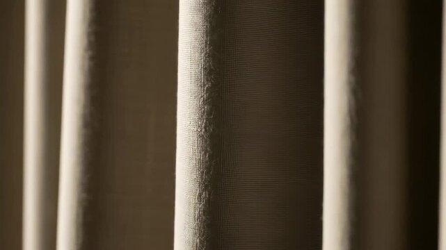 Elegant Beige Fabric Folds: Soft Light and Shadow Play