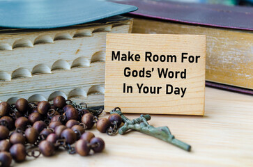 Make Room For God Word In Your Day text on wooden block with Holy Bible and Holy Rosary background....