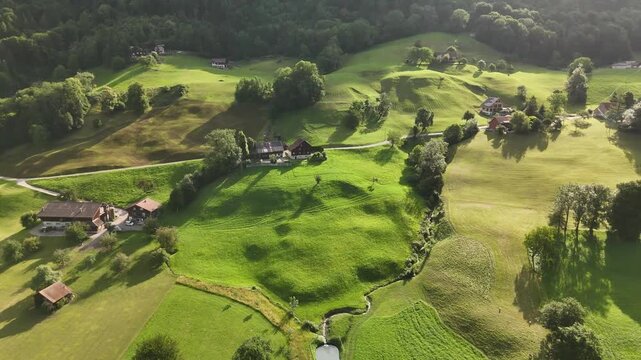 Scenic Aerial View of a Valley with Green Fields and Mountain Landscape in Switzerland near Flums, Berschis, and Walenstadt in the Canton of St. Gallen &ndash; Drone Footage