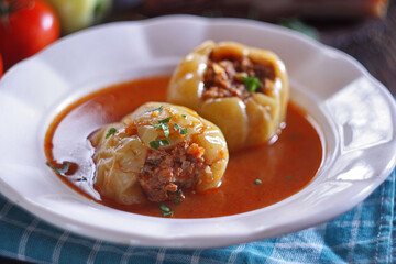 Stuffed peppers with minced meat and rice in tomato sauce
