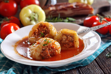 Stuffed peppers with minced meat and rice in tomato sauce
