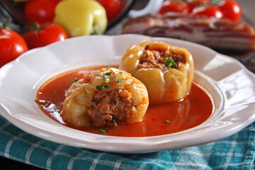 Stuffed peppers with minced meat and rice in tomato sauce
