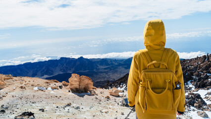 Tourist admiring rock formations in the Teide, Teide National Park, Tenerife, Canary Islands, Spain