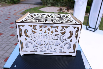 Dila, a wooden box with the inscription 