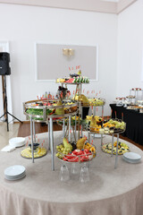 Fruit buffet table: watermelon, grapes, pears.