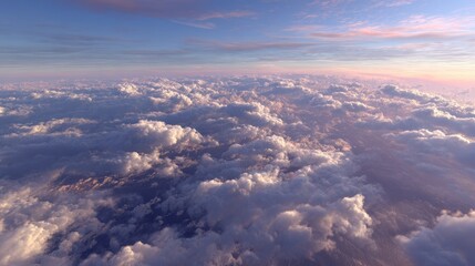 Above the clouds at sunset showcasing beautiful Cumulus formations in the horizon and blue sky, creating an aerial view