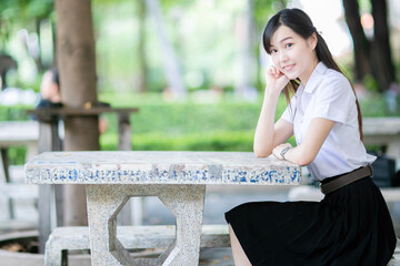 A beautiful and cute female student in her faculty uniform posed confidently during the university’s portrait photo shoot, perfectly representing the balance of charm and academic excellence.