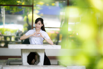 For the university’s annual magazine, the beautiful and cute female student from the education faculty was chosen for a portrait photo shoot that would reflect both charm and dedication.