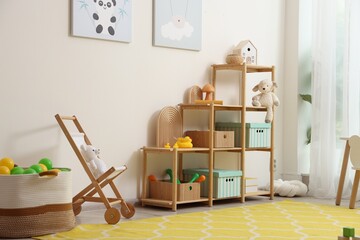 Stylish playroom with toys and furniture. Interior design