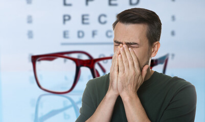Man with eyesight problems, glasses and vision test chart. Banner design