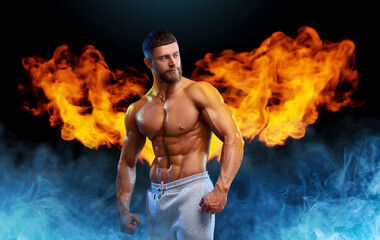 Bodybuilder with flaming wings behind his back against dark background. Shirtless muscular man in...